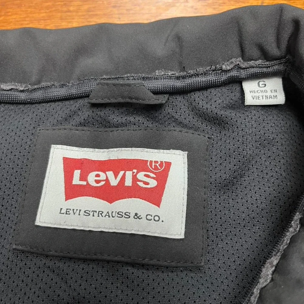 Levi's black soft shell jacket with snap button closure